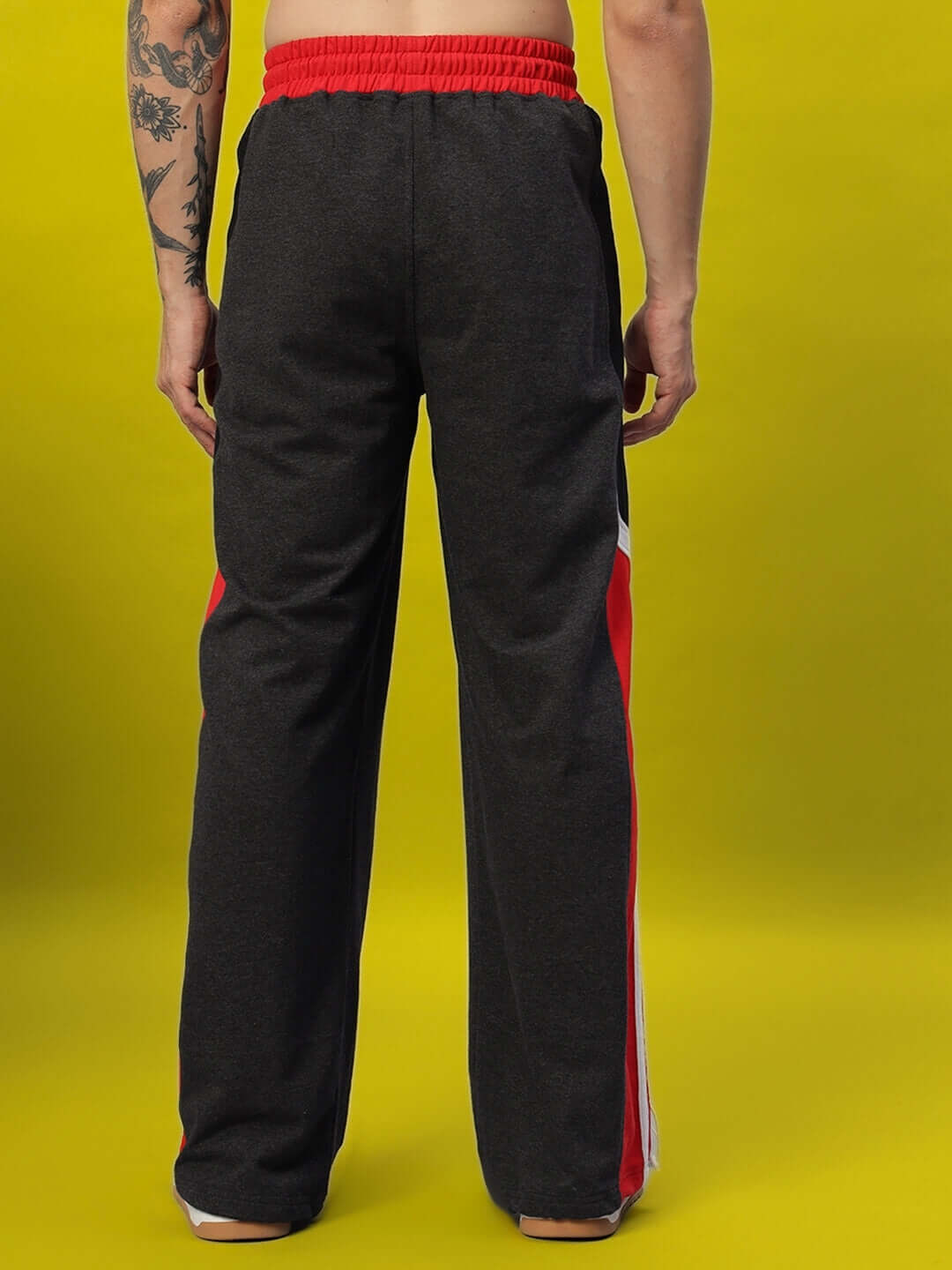 Back view of Snicker Relaxed-Fit Joggers in dark grey and red, showcasing comfortable tailoring, available with custom fit options.