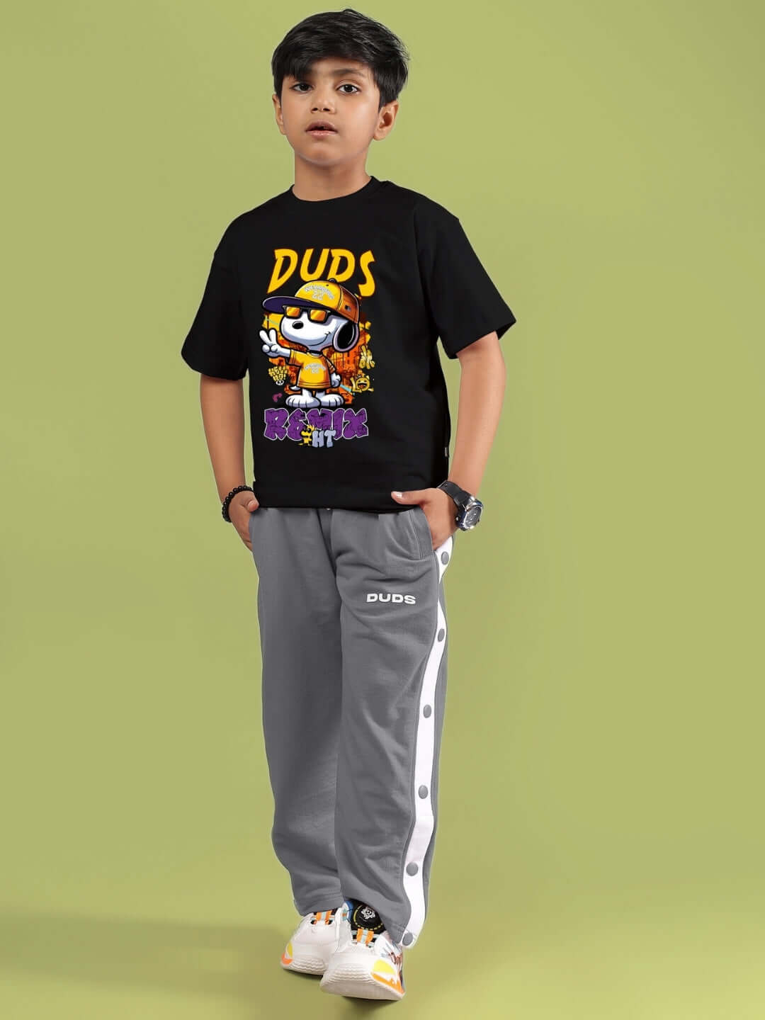 Child wearing SNOOPY RIMIX CO-ORD FOR BOYS & GIRLS BLACK GREY, showcasing DUDS t-shirt and pants.
