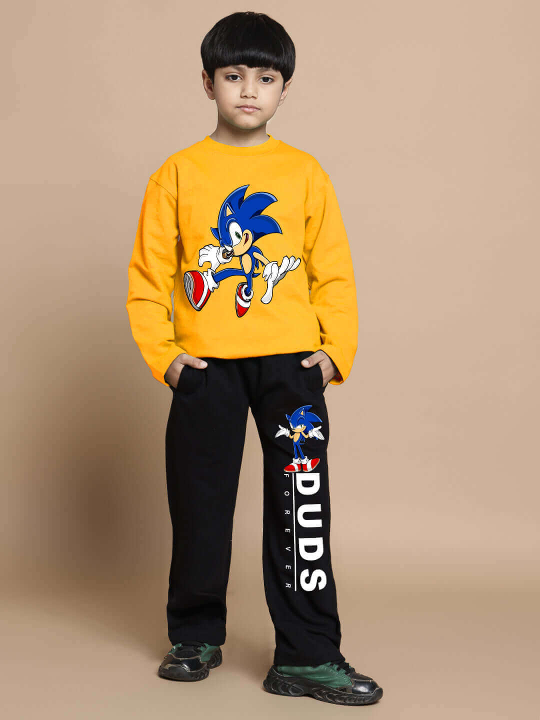 Child wearing yellow Sonic co-ord outfit featuring Sonic the Hedgehog design by DUDS, perfect for boys and girls.
