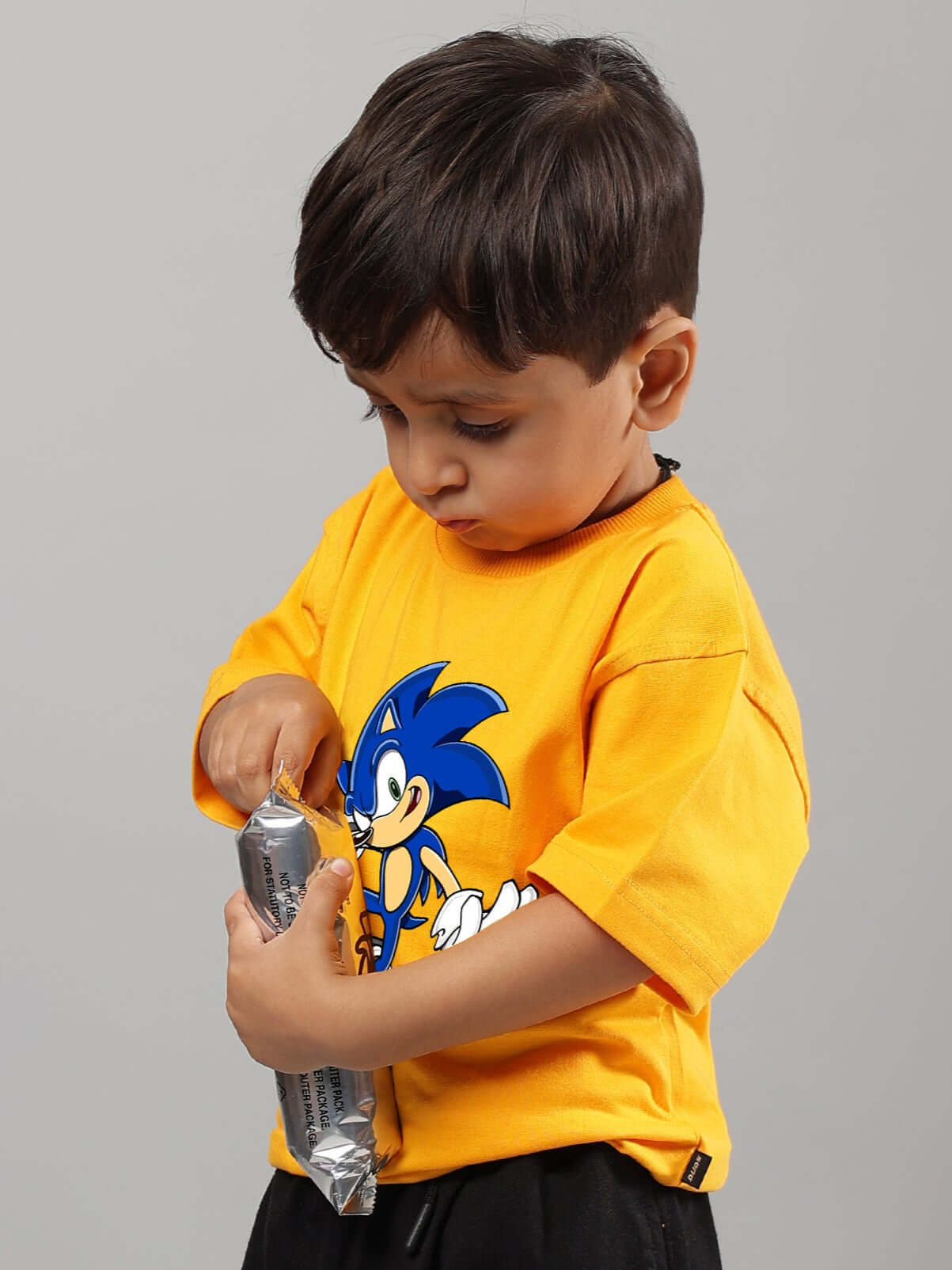 Child wearing a yellow Sonic summer t-shirt for boys & girls, DUDS made to order clothing.