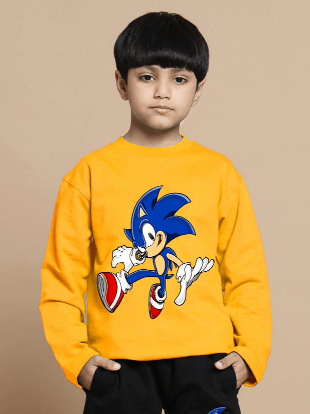 Child wearing yellow Sonic oversized sweatshirt designed for boys and girls, showcasing a vibrant character print, in cozy setting.