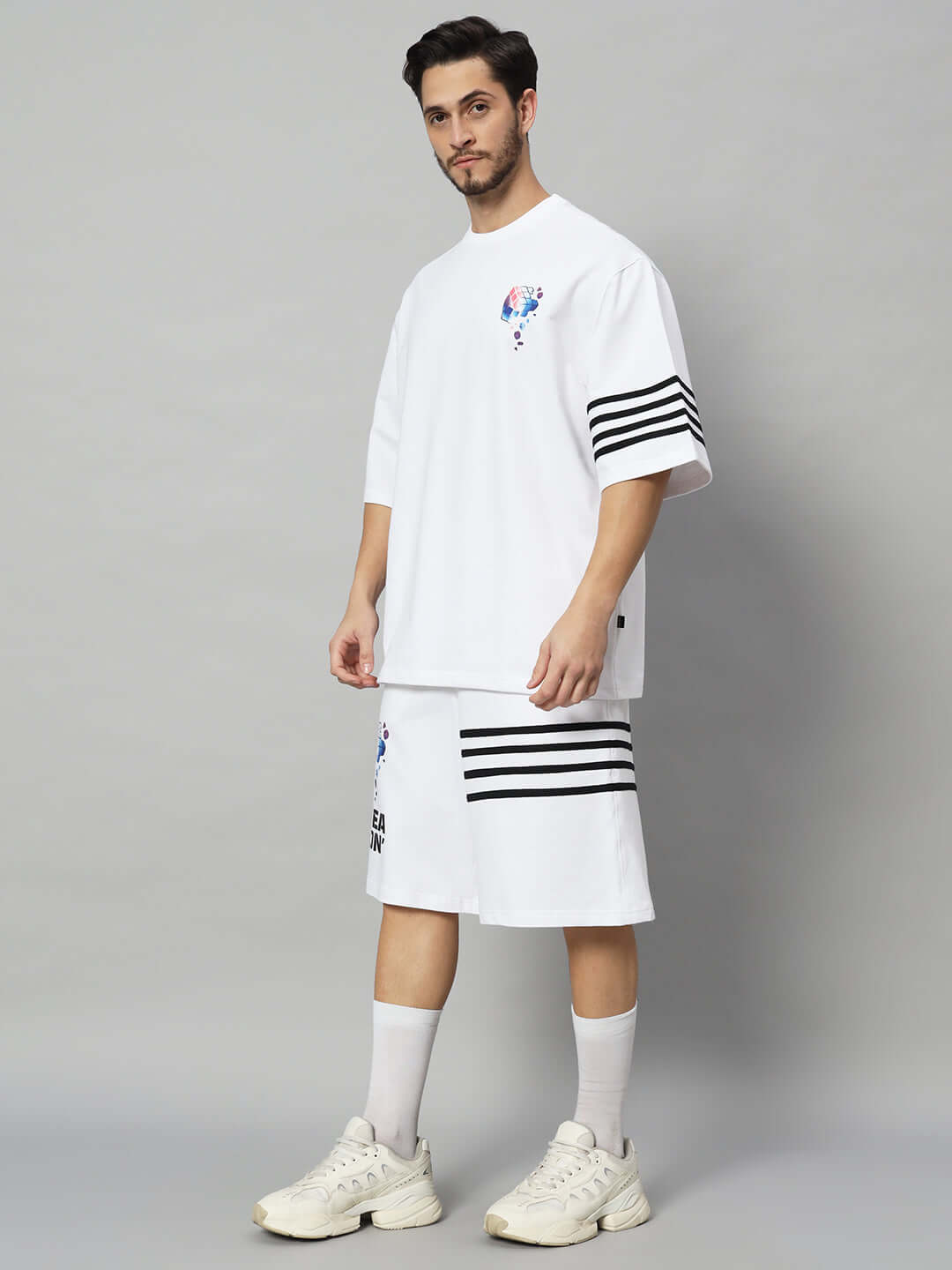 Model wearing SOUND SEASON CO-ORD SET in white, showcasing premium cotton French Terry fabric with stripe details, made in India.