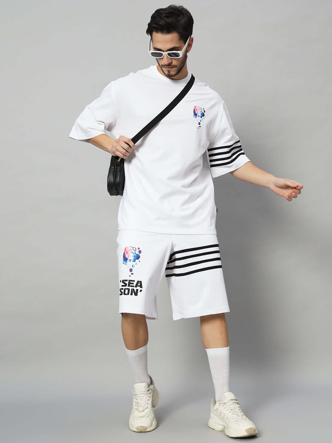 White SOUND SEASON CO-ORD set in premium cotton fabric, featuring striped sleeves and shorts, modeled with stylish sunglasses.