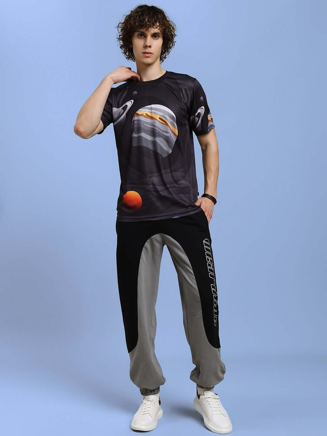 Man wearing black space fantasy printed t-shirt in sports polyester, perfect for stylish casual wear. Cold machine wash recommended.