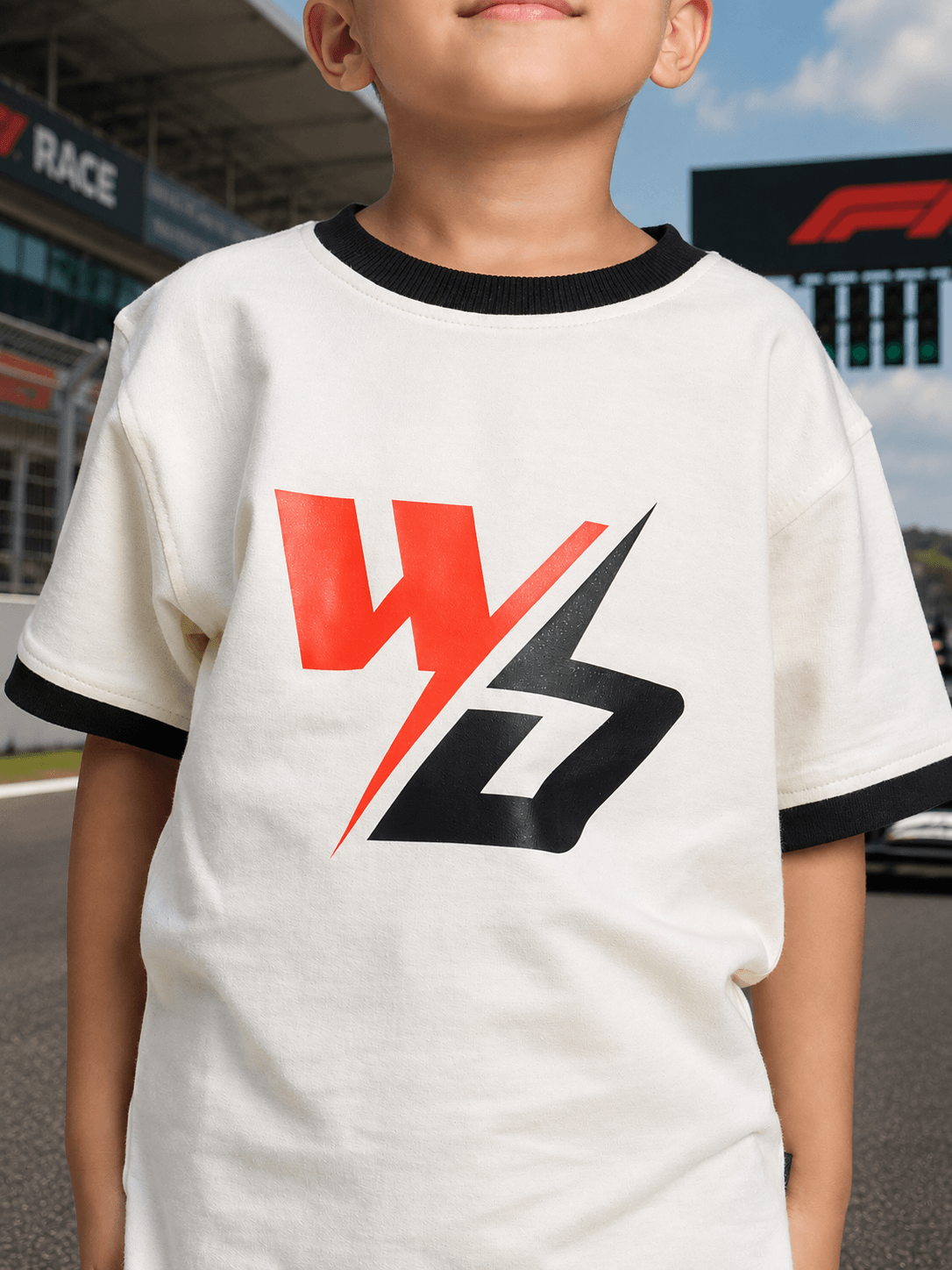 SPEED SURGE T-SHIRT FOR BOYS GIRLS WHITE worn by a child at a race event.