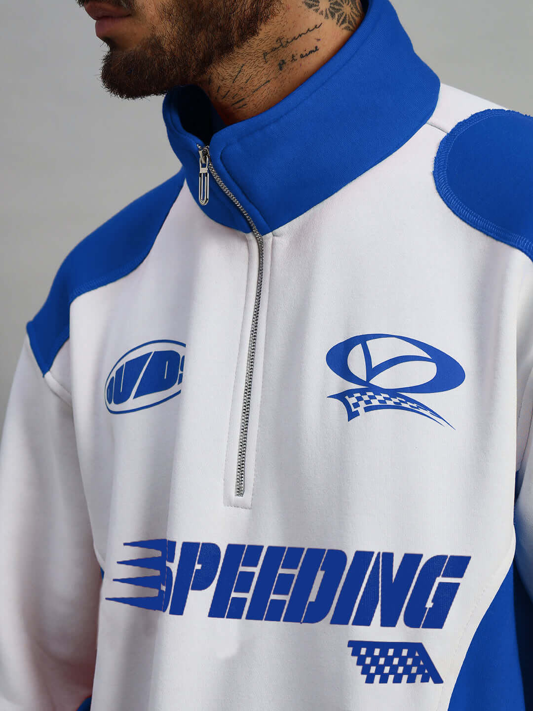 Royal blue Speeding colorblock jacket with zip collar and racing graphics, available for custom fit. Made to order.