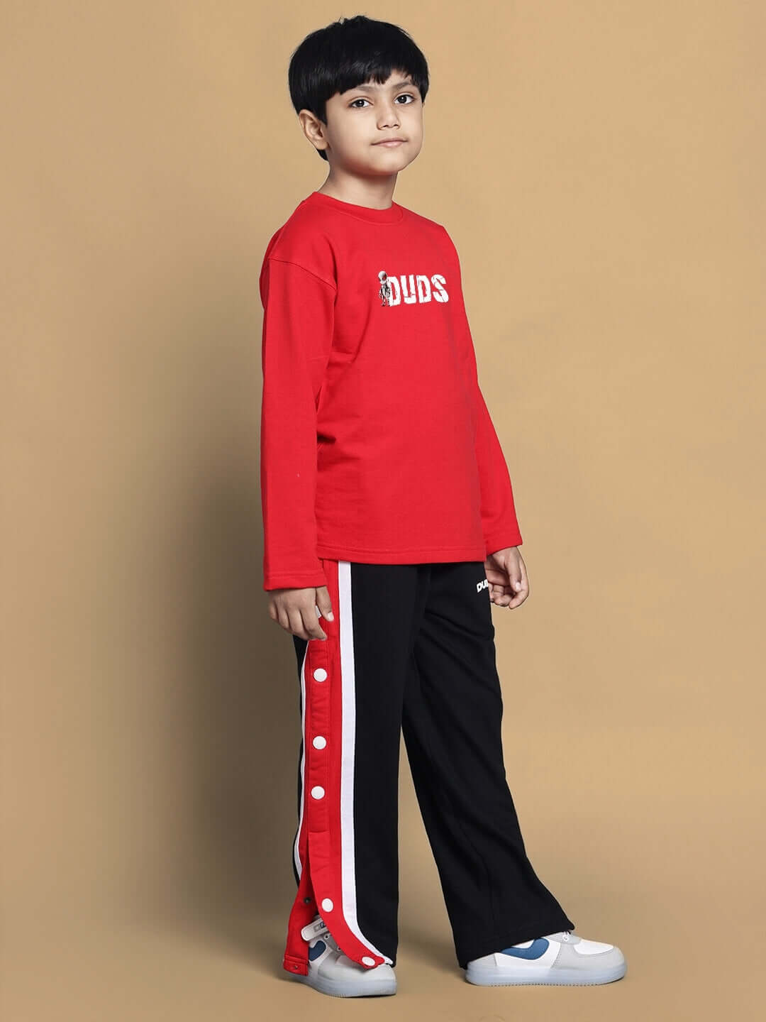 Child wearing SPIDERROBO Red Co-Ord Set by DUDS, styled for boys and girls.