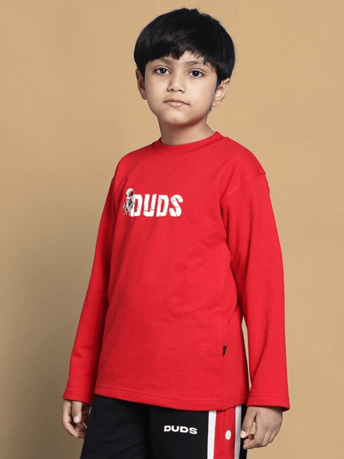 Child wearing a red Spiderrobo sweatshirt by DUDS, suitable for boys and girls, showcasing a casual and comfortable fit.