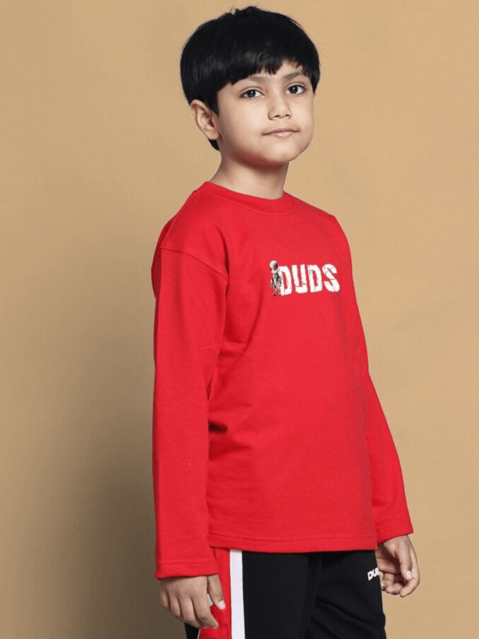 Child wearing red SpiderRobo sweatshirt from DUDS, suitable for boys and girls, showcasing a casual look.