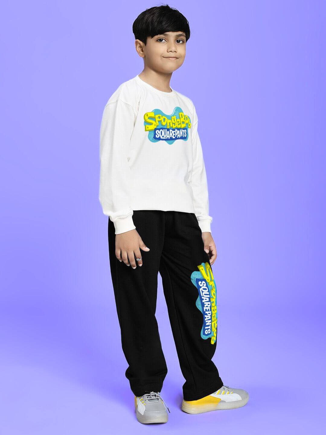 Kid wearing SPONGEBOB SQUAREPANTS CO-ORD FOR BOYS AND GIRLS WHITE BLACK against a purple background.