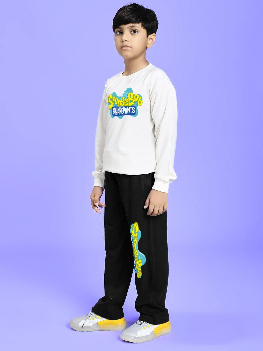 Child wearing SPONGEBOB SQUAREPANTS CO-ORD FOR BOYS AND GIRLS WHITE BLACK featuring cartoon design on lilac background.