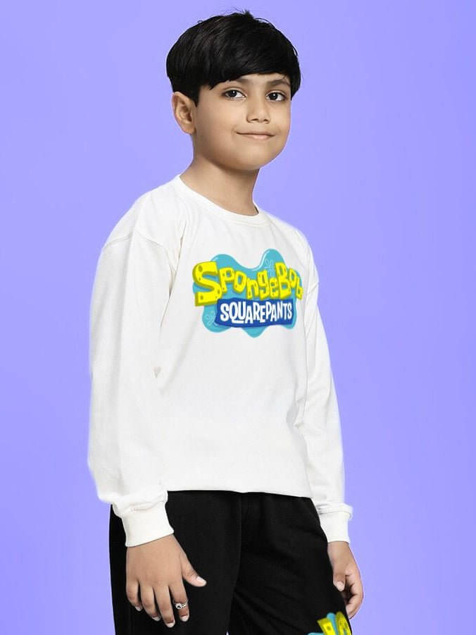 Boy wearing SPONGEBOB SQUAREPANTS SWEATSHIRT FOR BOYS AND GIRLS WHITE with nature vibes bird print, cheerful outfit.