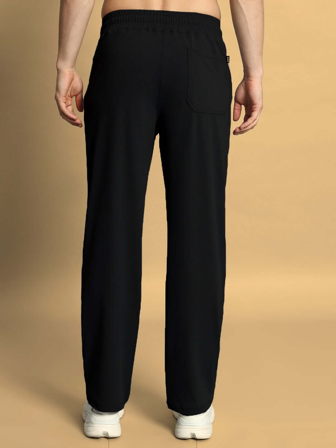 Back view of SPRINGY RELAXED FIT JOGGER in black, showcasing elastic waistband and tailored fit, by DUDS. Customizable size available.