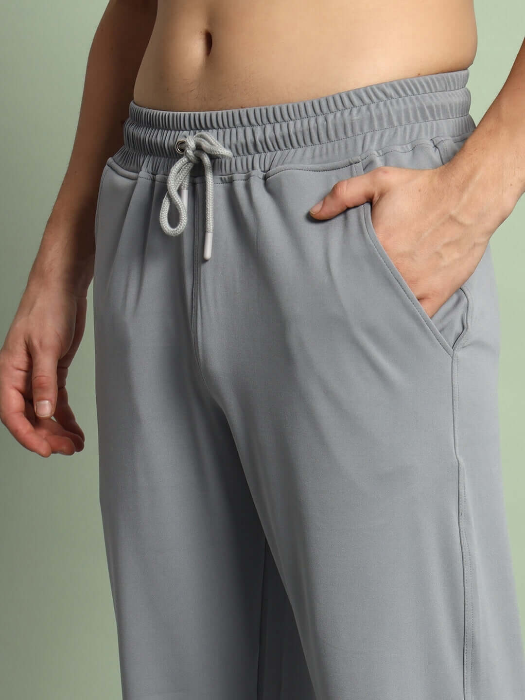 Close-up of grey Springy Relaxed Fit Jogger with drawstring and pocket details.
