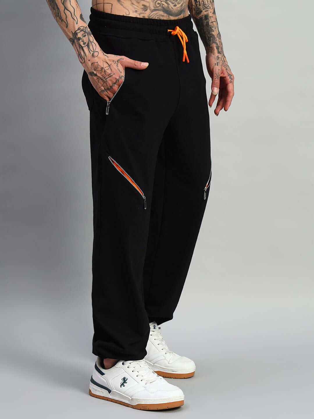 Stylish black SQUALL joggers by DUDS, featuring a customizable fit option and vibrant detailing, perfect for casual or athletic wear.