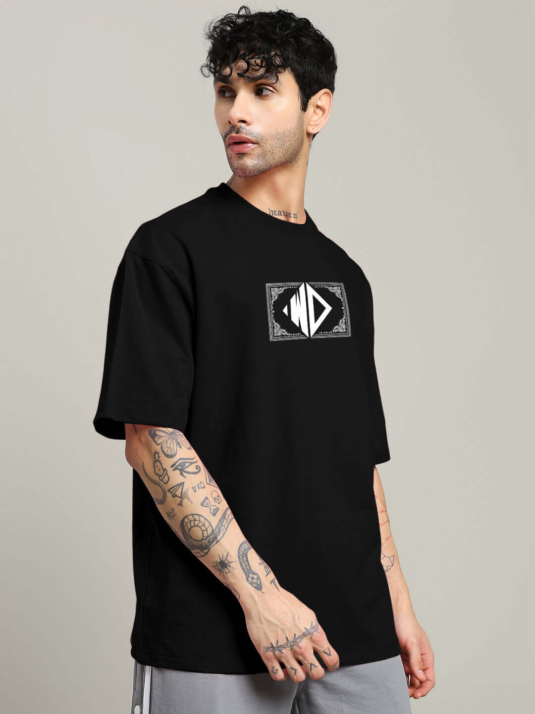 Model wearing SQUARE FRAME OVERSIZED T-SHIRT in black, made from premium heavy gauge fabric with 97% cotton, showcasing a stylish and comfortable fit.