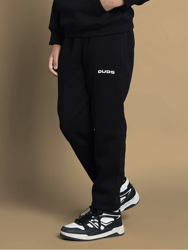 Child wearing SQUID BIRD FLEECE CO-ORD FOR BOYS GIRLS BLACK with playful squid bird graphics.