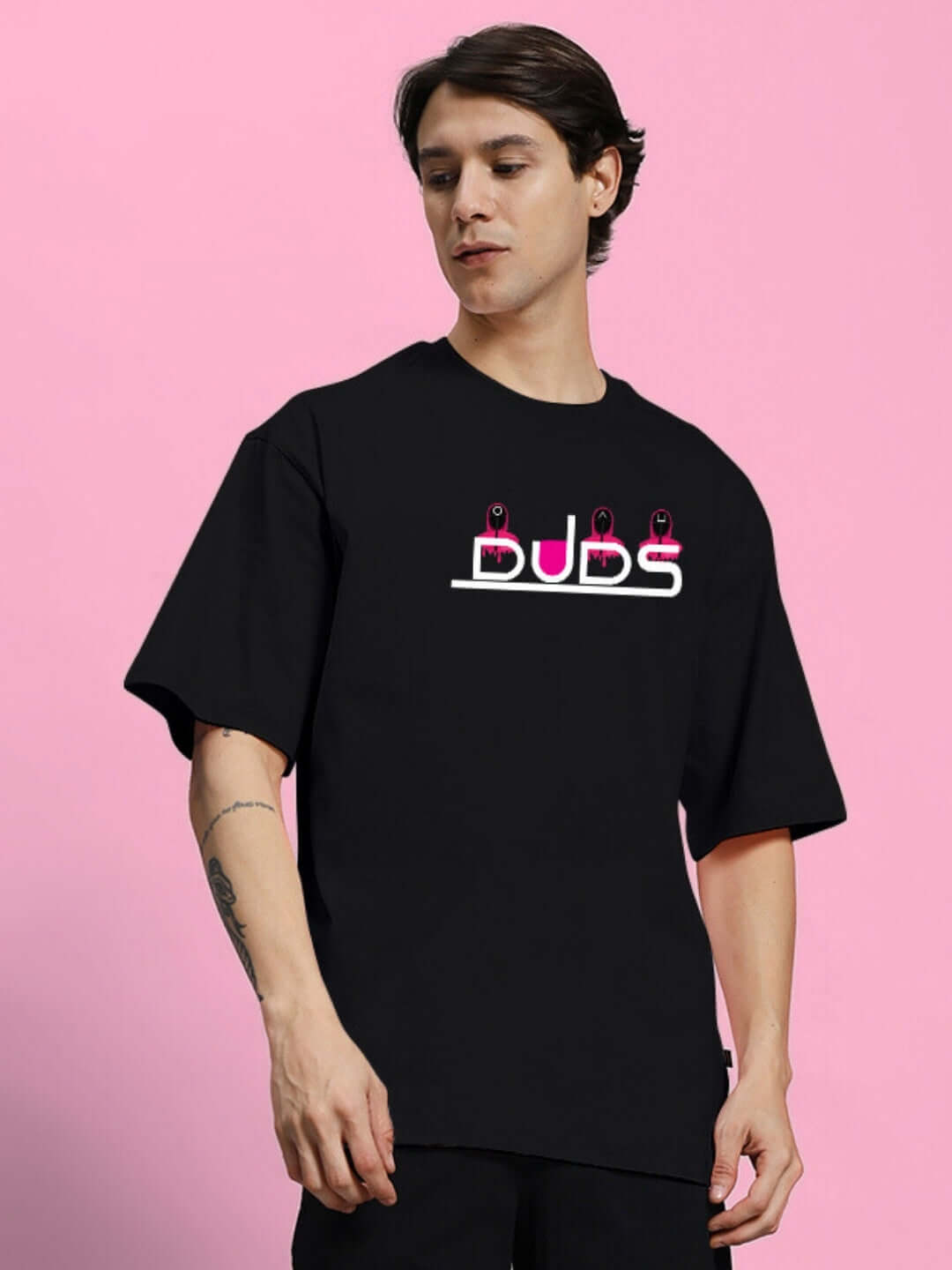 Model wearing SQUID GAME PRINTED OVERSIZED T-SHIRT BLACK with premium 100% cotton fabric.