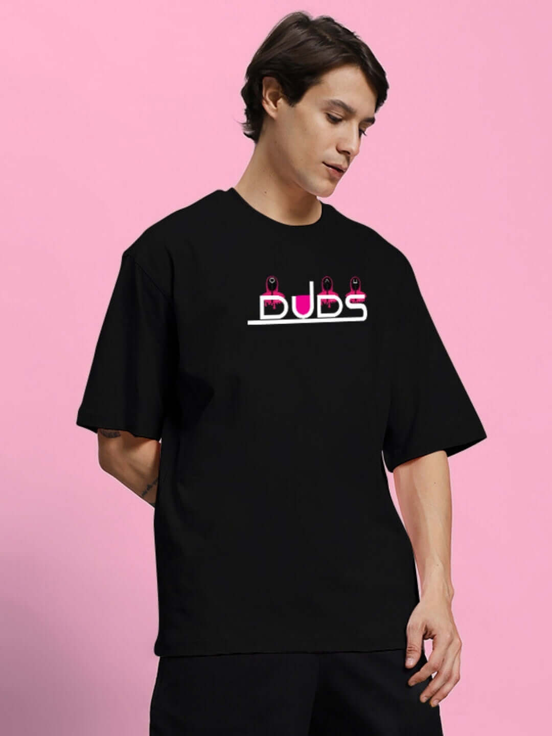 SQUID GAME PRINTED OVERSIZED T-SHIRT BLACK on model, featuring premium heavy gauge fabric, 100% cotton, 200 GSM bio-washed for comfort.