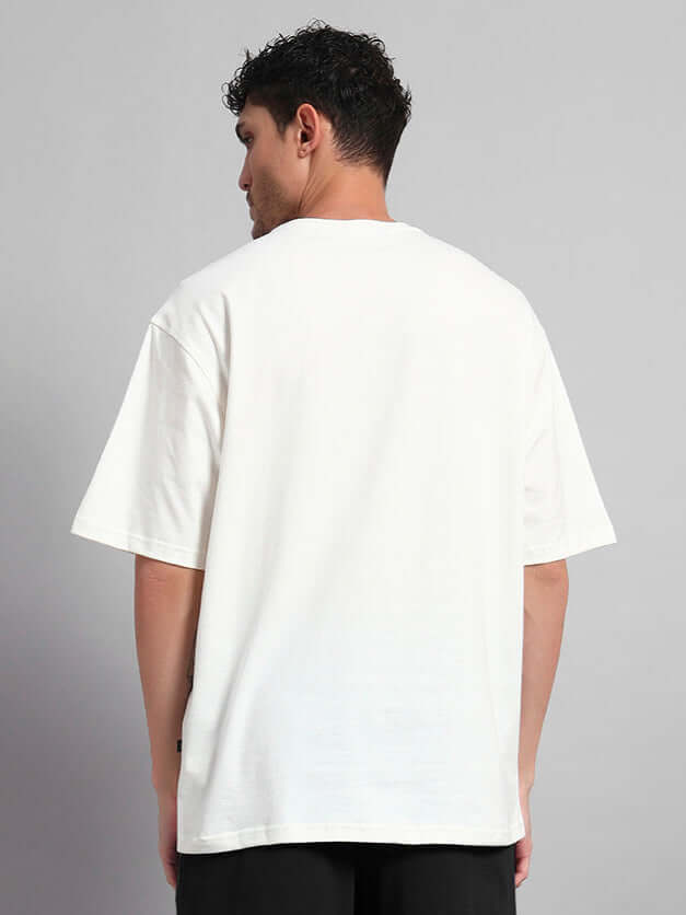 Back view of model wearing Starry Sky Oversized T-Shirt in off white, showcasing relaxed fit and premium cotton fabric.