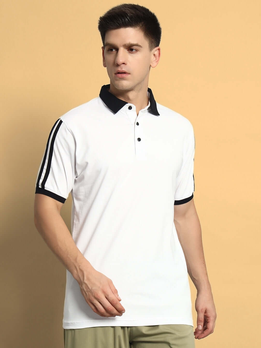 Model wearing STAUNCH white polo t-shirt, regular fit, half sleeves, 100% cotton, comfortable for all-day wear.
