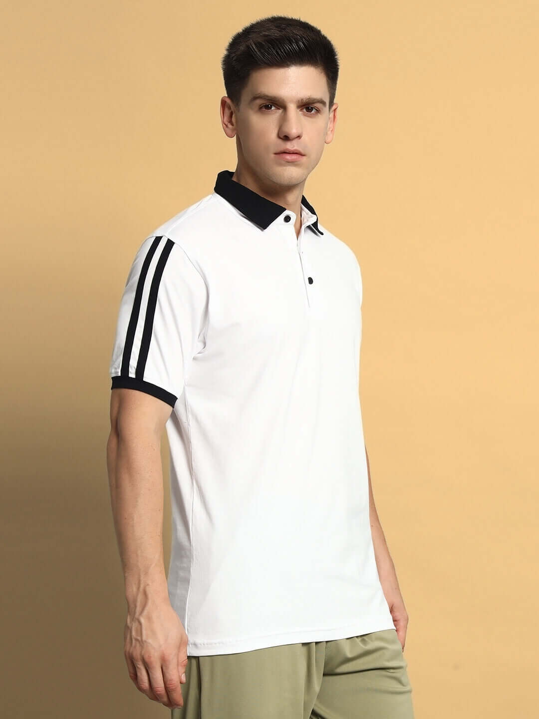 Model wearing STAUNCH Polo Regular Fit T-shirt in white, half sleeves, premium cotton, comfortable for all-day wear, Indian made.