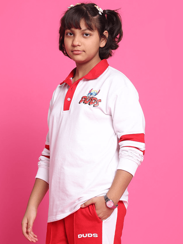 STITCH OVERSIZED SWEATSHIRT FOR BOYS GIRLS WHITE RED, model wearing sweatshirt with playful style against pink background.