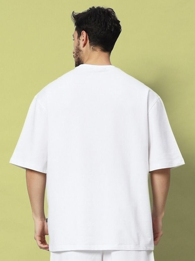 Back view of STRATEGY RUSE OVER-SIZED T-SHIRT WHITE on model