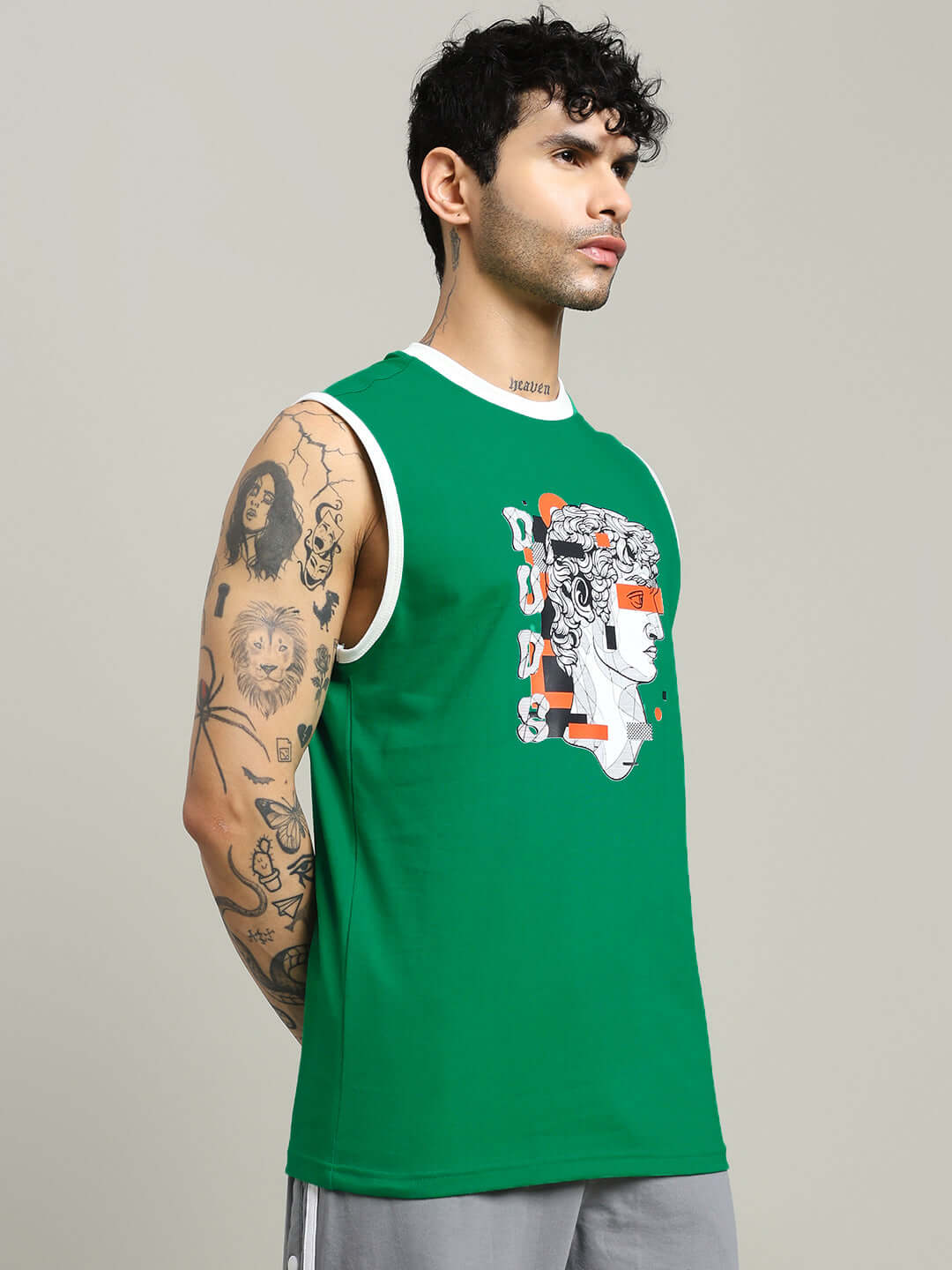Man wearing STREAM REGULAR FIT T-SHIRT GREEN, showcasing street style and casual comfort, featuring graphic print design.