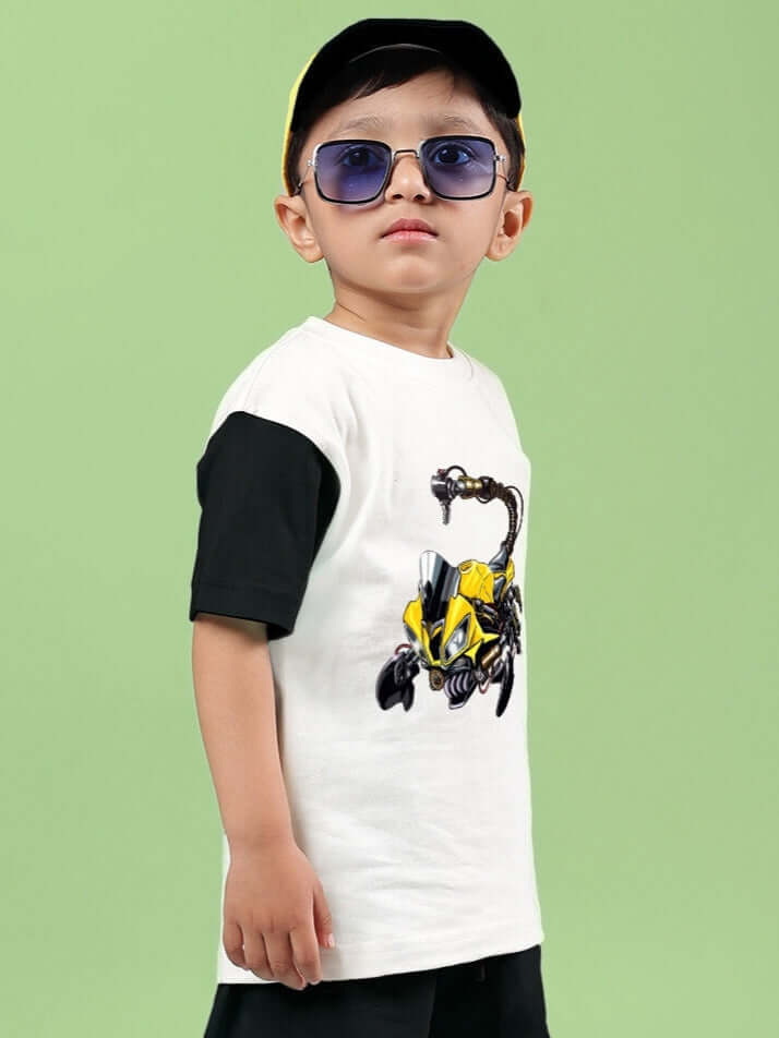 Child wearing STYLISH ROBOT T-SHIRT FOR BOYS & GIRLS OFF WHITE-BLACK with robot print, standing against green background