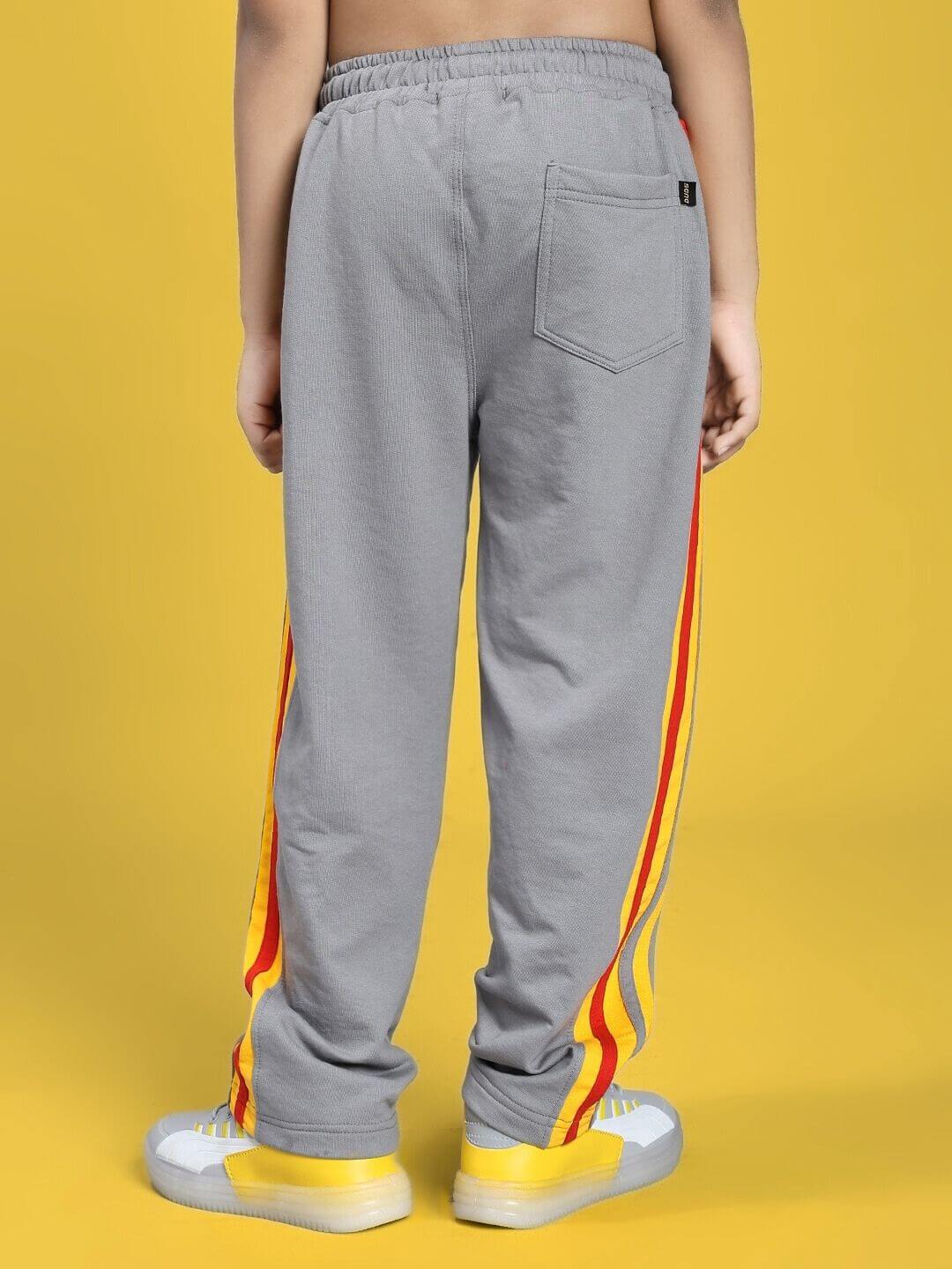 Back view of SUNSHINE STRIPE JOGGER FOR BOYS AND GIRLS RED GREY on a yellow background.