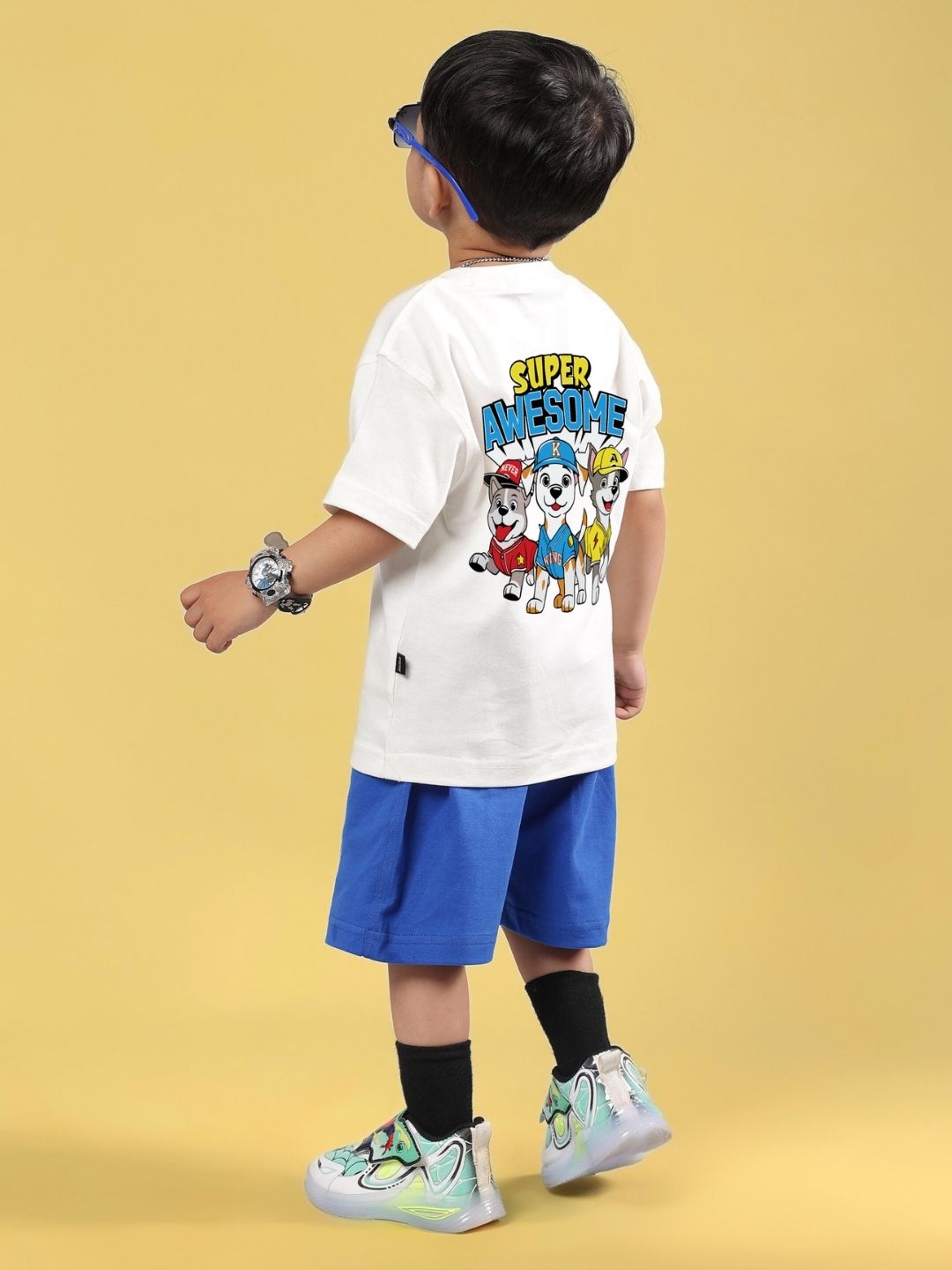 SUPER AWESOME CO-ORD FOR BOYS AND GIRLS OFF WHITE ROYAL BLUE outfit with graphic tee and shorts. Child wearing matching set.
