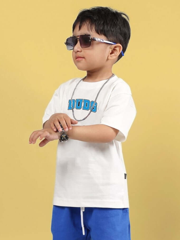 Boy wearing SUPER AWESOME T-SHIRT FOR BOYS AND GIRLS OFF WHITE with sunglasses