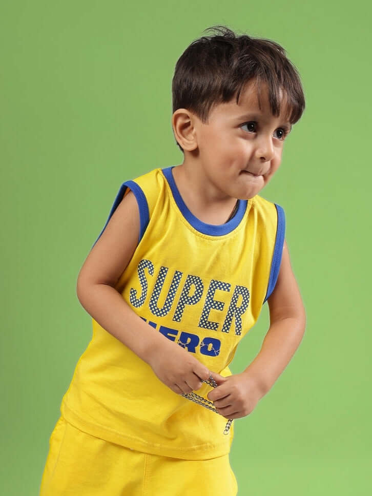 Child wearing SUPER HERO T-SHIRT FOR BOYS & GIRLS YELLOW, playful and bright superhero style for kids.