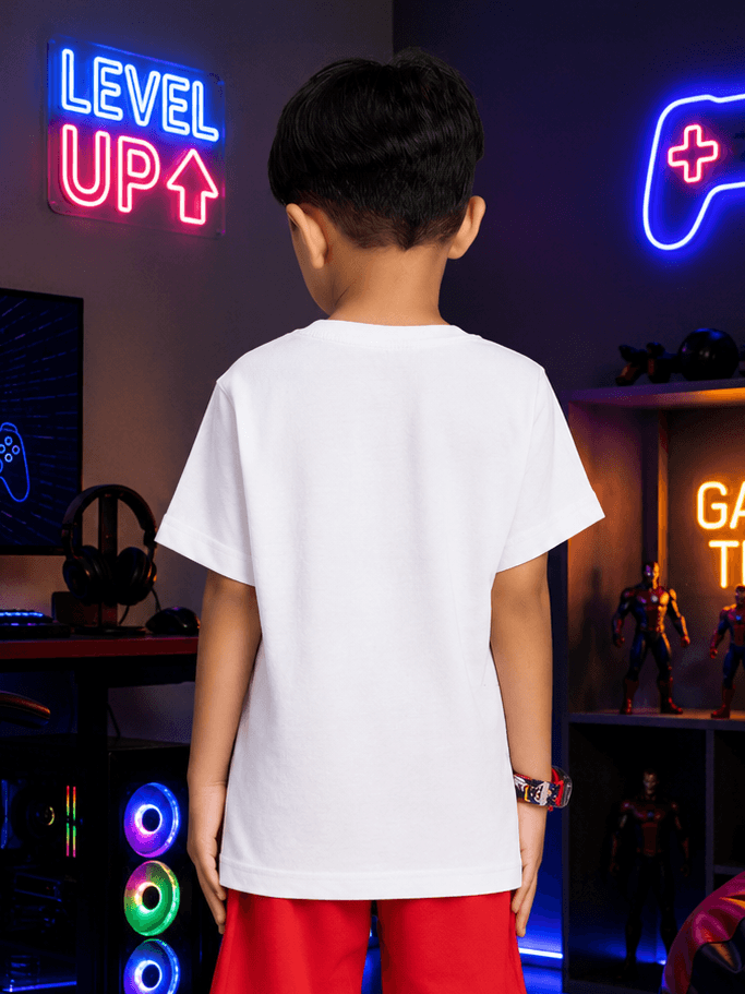Back view of a child wearing a SUPER MARIO GRAPHIC T-SHIRT FOR BOYS GIRLS WHITE in a gaming room.