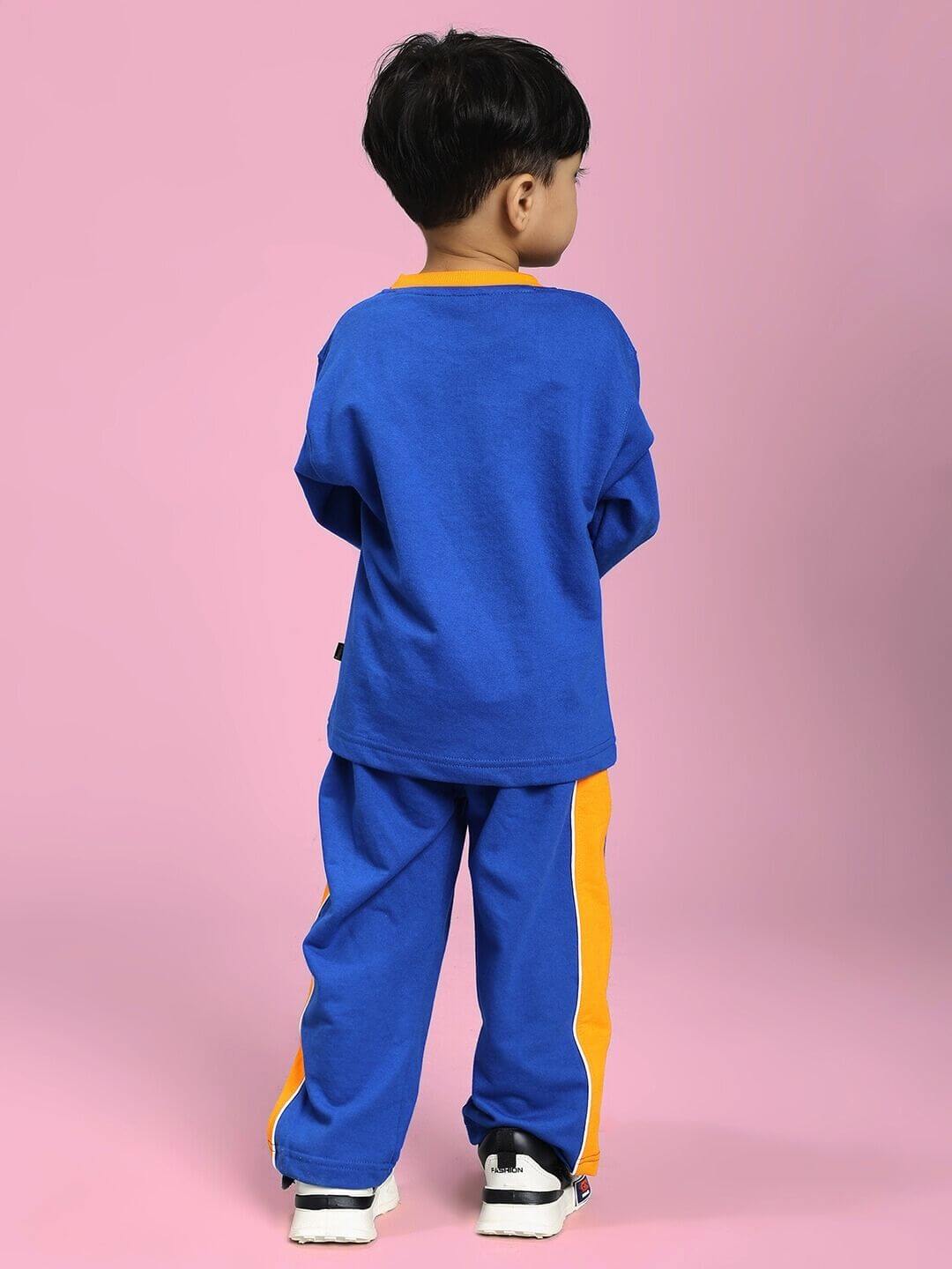 Child wearing the SUPER SAIYAN CO-ORD SET FOR BOYS AND GIRLS BLUE, featuring a blue sweatshirt and joggers, ideal for active play.