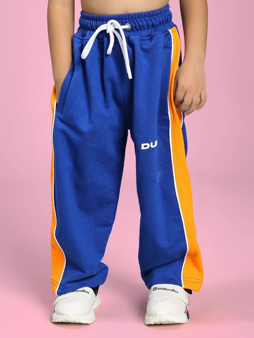 Child wearing vibrant blue joggers from Super Saiyan Co-ord Set for Boys and Girls Blue, showing stylish comfort and adventure-ready design.