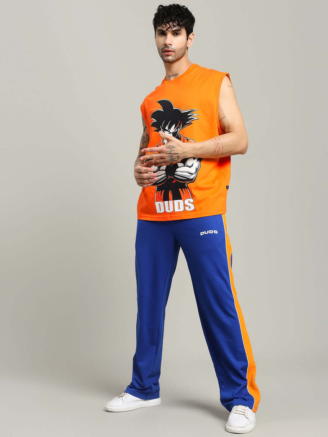 Model wearing orange Super Saiyan gym t-shirt by DUDS with custom fit option available for prepaid orders.