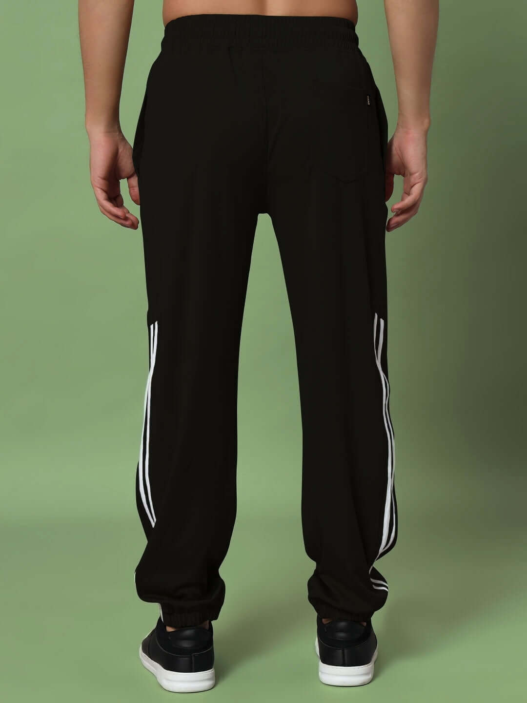 Back view of black Superb Relaxed Pant Jogger with white stripes, made by experienced DUDS tailors, available in custom fit.