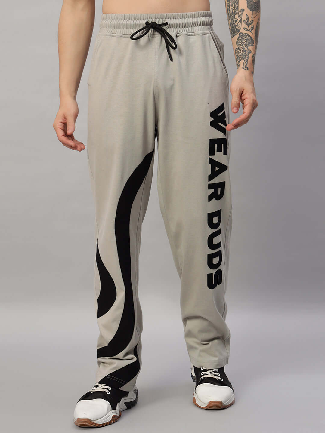 Model wearing SURFING OVERSIZED CO-ORD SET GREY with relaxed fit joggers, elastic waistband, and contrasting panel design.