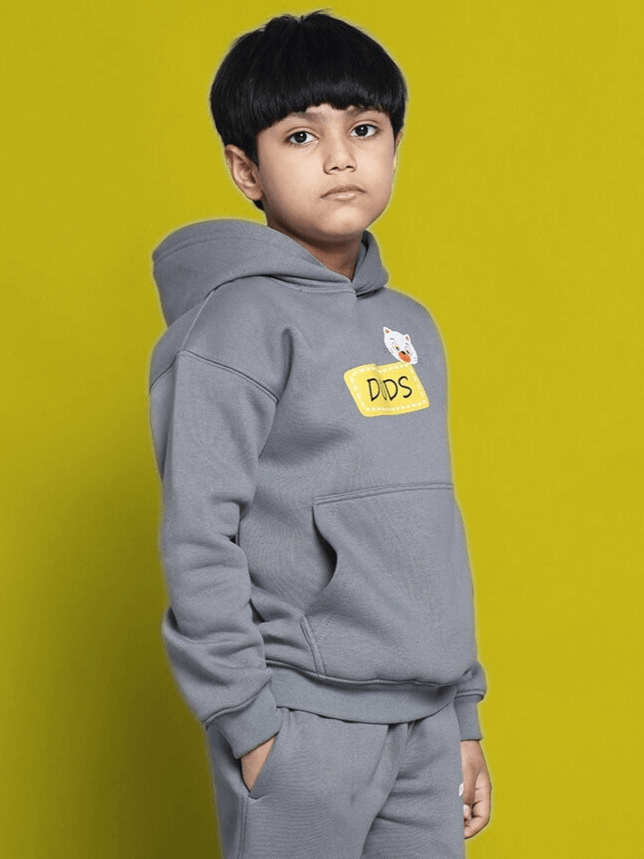 Child wearing Tabby Oversized Fleece Hoodie for Boys Girls Grey, front view, indoor setting, showcasing cozy and stylish design.