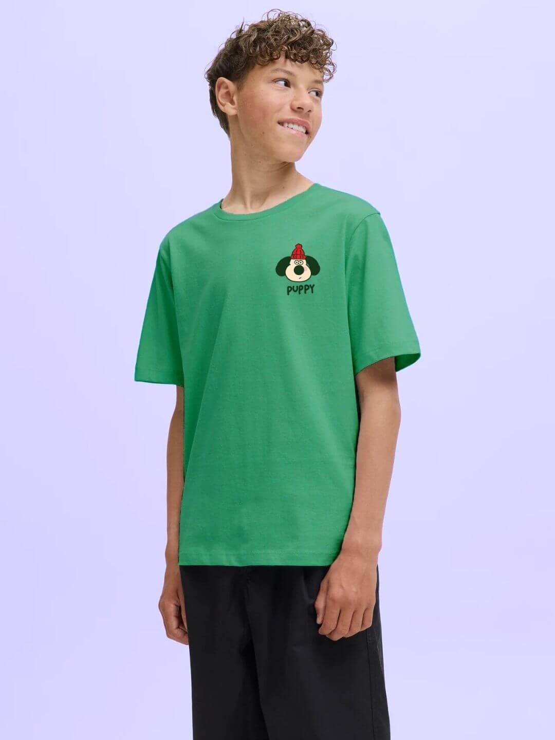 Boy wearing TADDY PUPPY T-SHIRT FOR BOYS AND GIRLS GREEN, showcasing playful design and comfort.