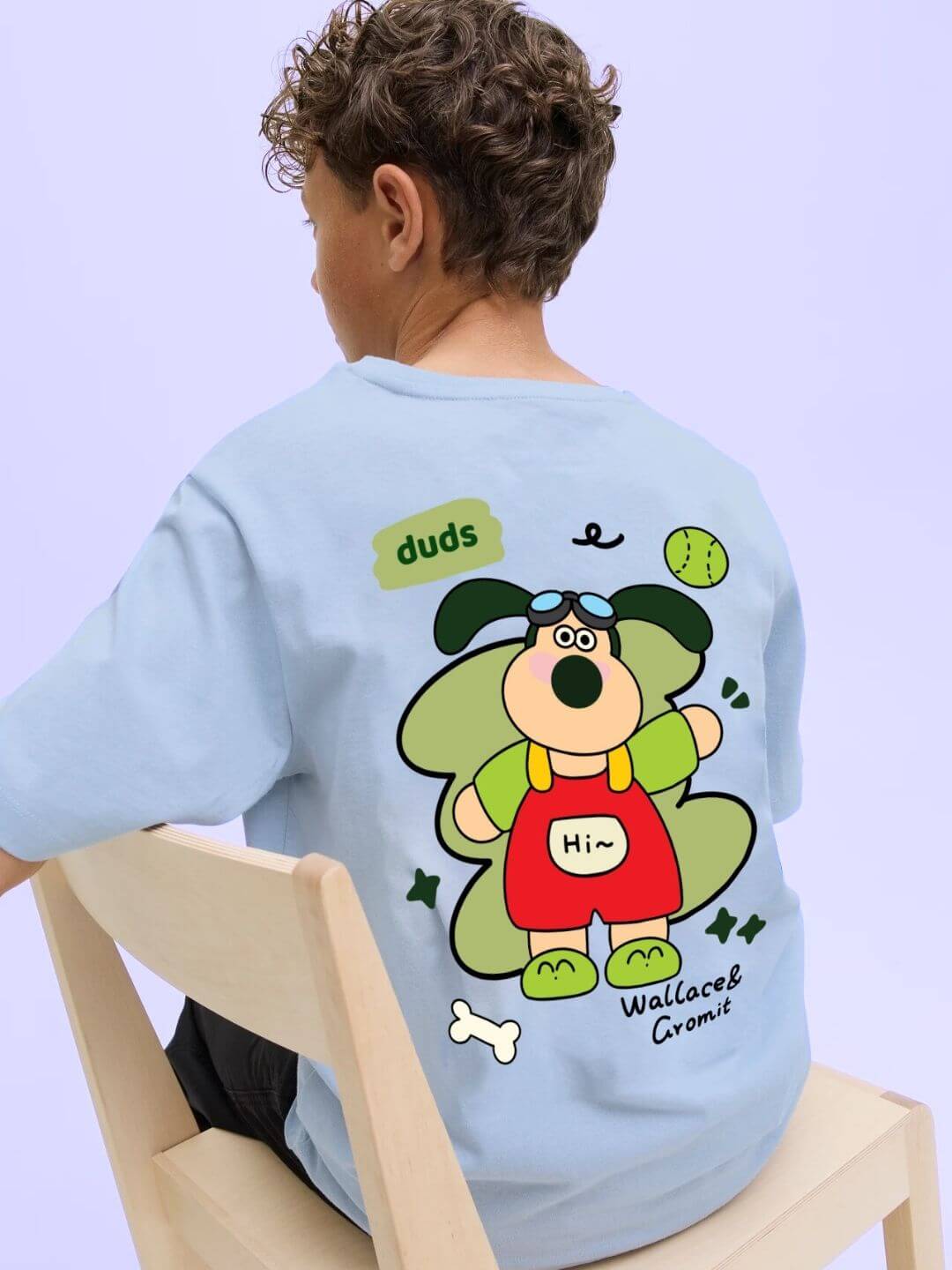 Child wearing TADDY PUPPY T-SHIRT FOR BOYS AND GIRLS SKY BLUE, featuring playful puppy design on the back.