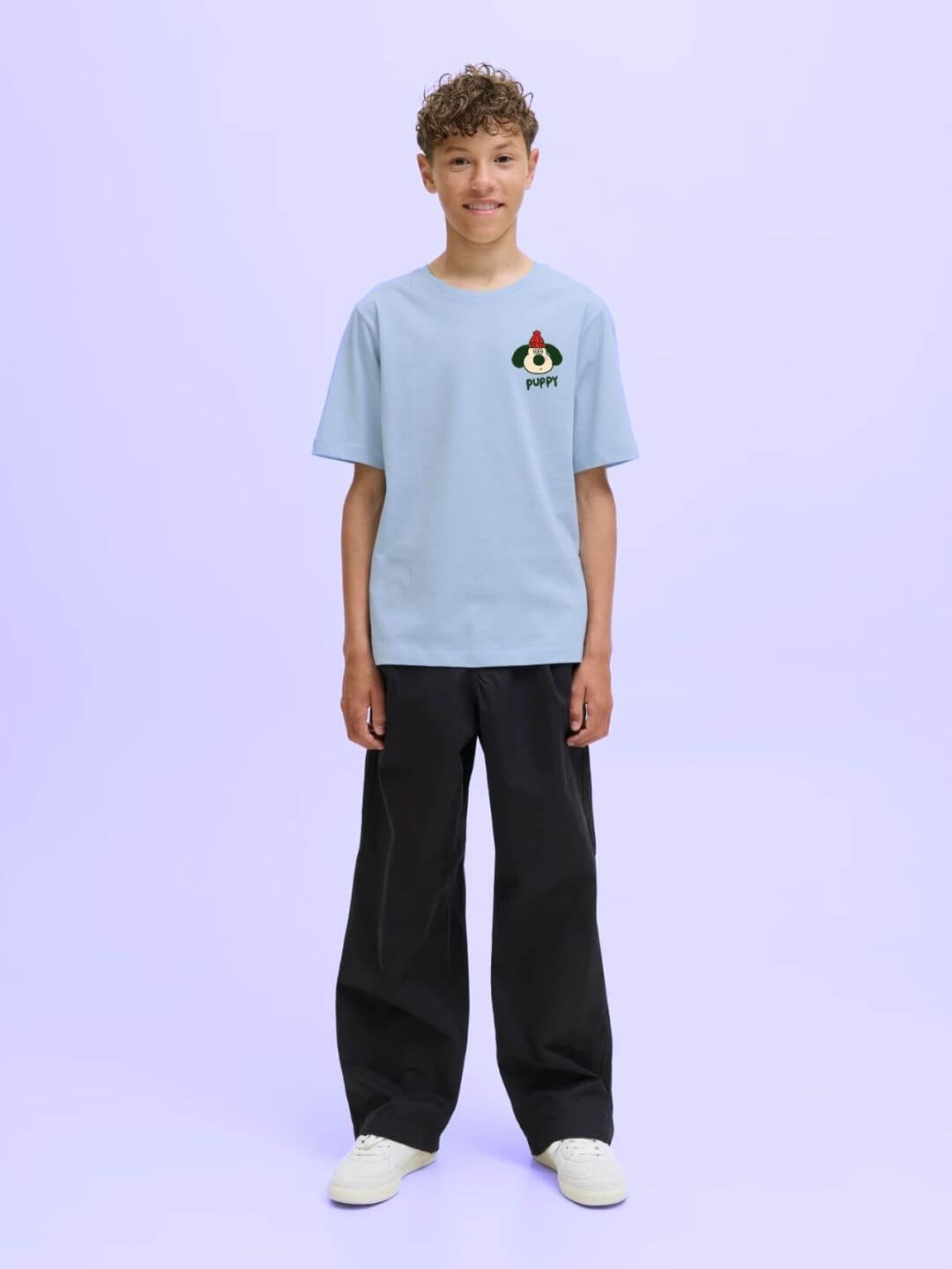 Child wearing TADDY PUPPY T-SHIRT FOR BOYS AND GIRLS SKY BLUE, showcasing playful design and comfort in a fresh sky-blue color.