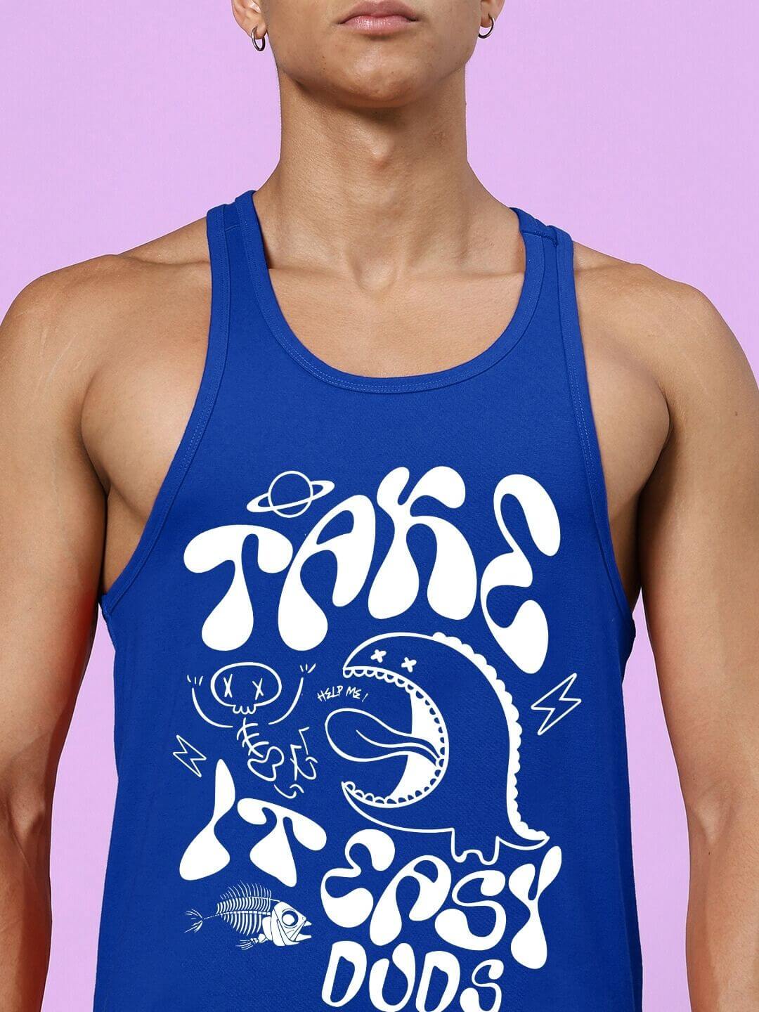 Man wearing TAKE IT EASY GYM CO-ORD SET BLUE with graphic design on tank top