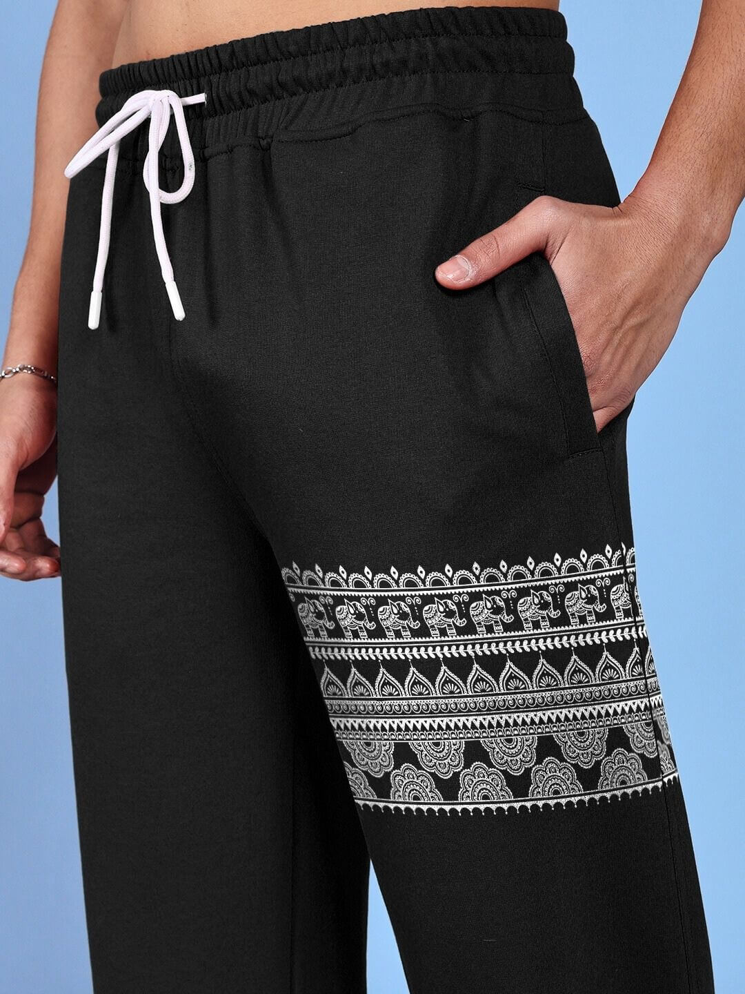 Close-up of Thai traditional printed relaxed fit jogger black showcasing intricate patterns.