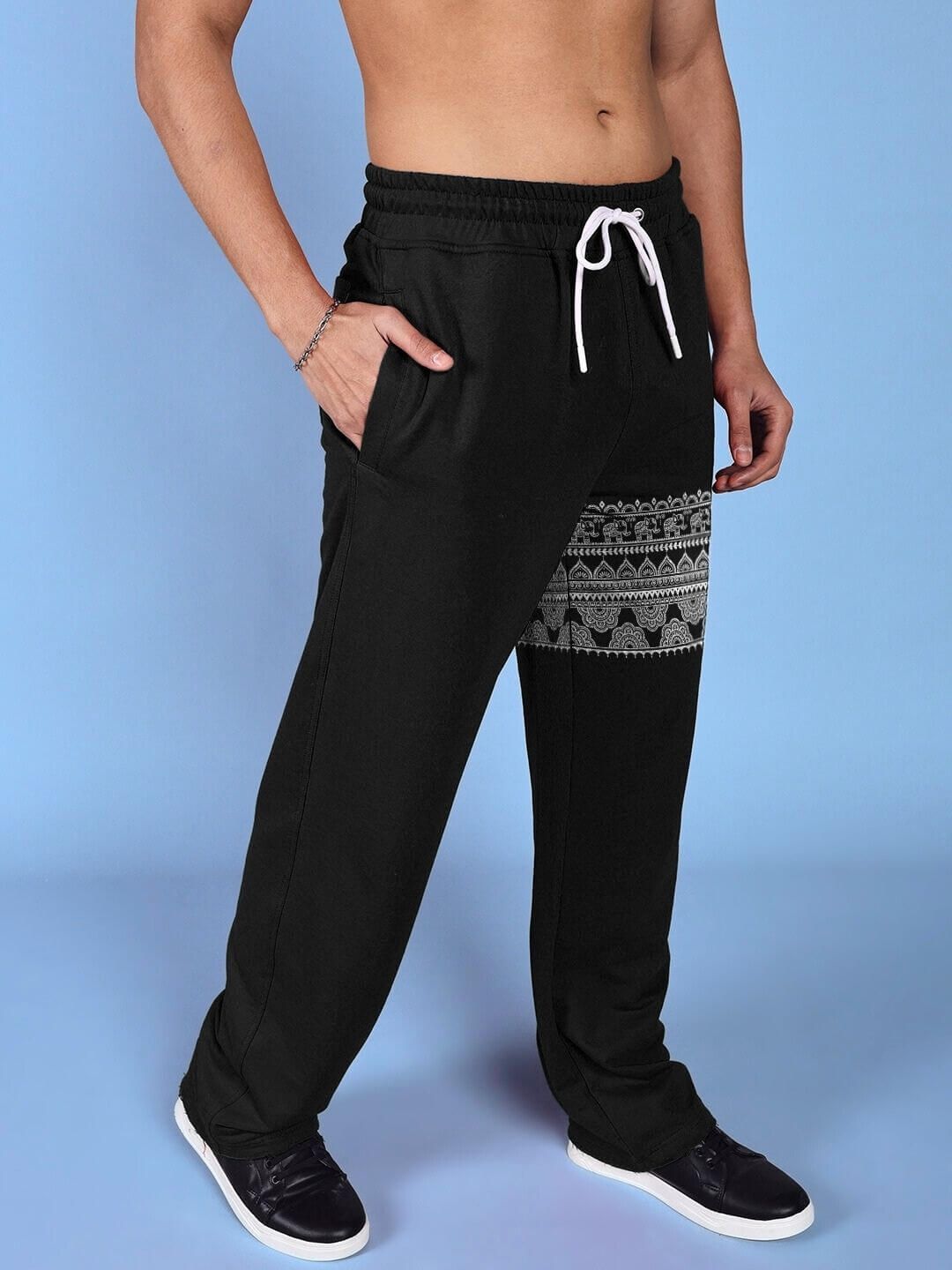 Front view of THAI TRADITIONAL PRINTED RELAXED FIT JOGGER BLACK with intricate patterns on sleek black fabric, perfect for casual wear.