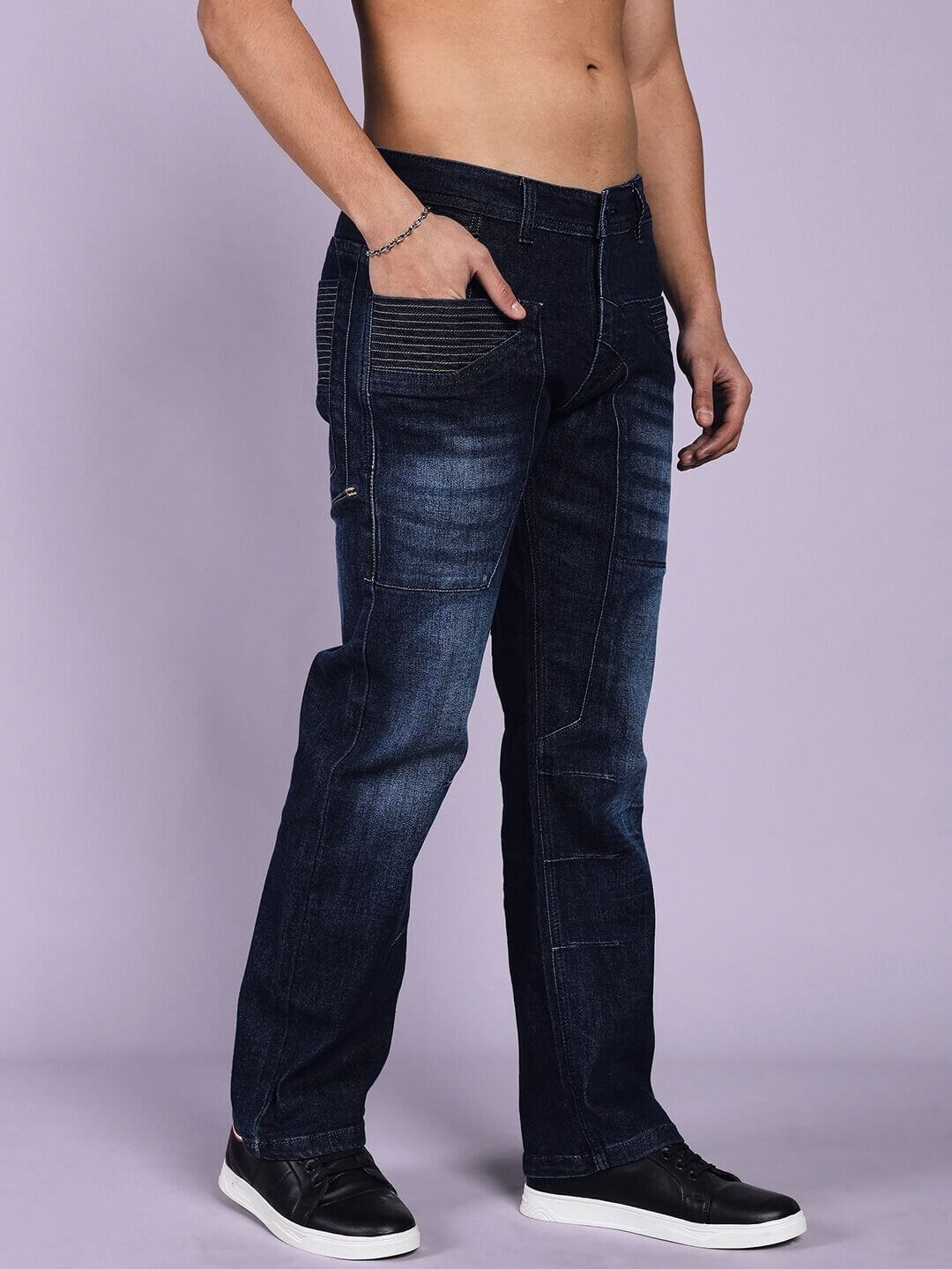 Model wearing Thrifty Regular Fit Dark Blue Denim Jeans by DUDS, showcasing stylish design tailored by skilled artisans.