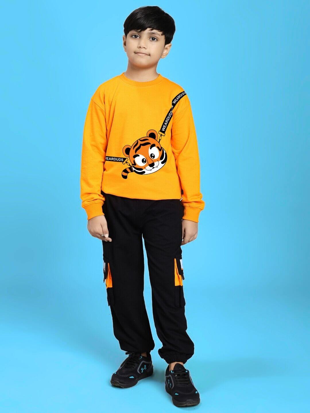 Boy wearing TIGON KIDS SWEATSHIRT FOR BOYS AND GIRLS ORANGE, featuring a vibrant tiger design, perfect for stylish and cozy everyday wear.