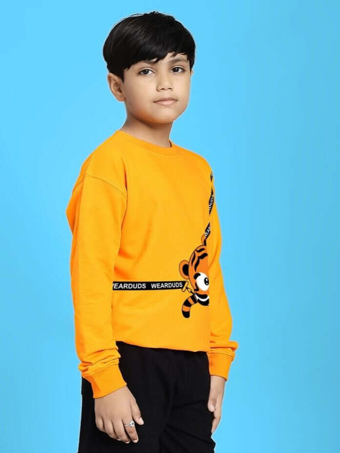 Child wearing TIGON KIDS SWEATSHIRT FOR BOYS AND GIRLS ORANGE, showcasing vibrant color and style.